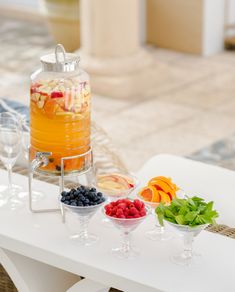 an assortment of fruits and drinks on a table