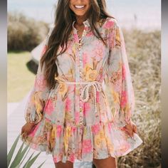 Gorgeous Vibrant Multi-Colored Floral Printed Sheer Dress Featuring A Button Up Closure Front And Ruffled Bottom Hem! Does Not Include The Rope Belt Shown In The Pictures - Can Be Paired With Any Belt! Features A Pink Sheer Slip As Lining 100% Polyester Model Is 5'6" With A 35" Bust, 28" Waist, And 36" Hips And Wearing A Small. Long Sleeve Mini Dress With Button Closure For Vacation, Spring Vacation Mini Dress With Buttons, Spring Beach Mini Dress With Buttons, Spring Mini Dress With Buttons For Beach, Multicolor Mini Dress With Buttons For Summer, Summer Multicolor Mini Dress With Buttons, Feminine Button-up Beach Dresses, Yellow Buttoned Dress For Vacation, Spring Multicolor Mini Dress With Buttons