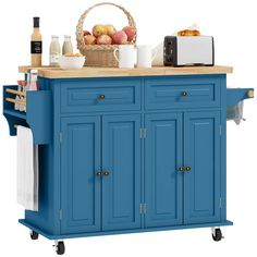 a blue kitchen island with two baskets on top