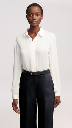 Here’s what happens when an everyday item piece gets an elegant twist. Made of airy Georgette silk, this versatile blouse features bubble sleeves, smart cuffs, and a relaxed fit for effortless layering. Pair with wide-leg trousers, heels, and bold accessories for a classy look that never misses. Timeless Silk Blouse For Daywear, Classic Blouse With Balloon Sleeves And Button Cuffs, Classic Silk Blouse With Cuffed Sleeves, Classic Tops For Workwear With Balloon Sleeves, Classic Workwear Top With Balloon Sleeves, Classic Balloon Sleeve Tops For Workwear, Classic Balloon Sleeve Top For Work, Classic Tops With Blouson Sleeves, Classic Silk Tops With Blouson Sleeves