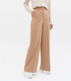 New Look Tall Camel Wide Leg Trousers. Tall. Day or night, these camel wide leg trousers work for both. High waist. Belt loops. Side and back pockets. Wide leg. Hook and zip-fly fastening. Lightweight woven fabric. Regular fit. Toma is 5'10"/ 178cm and wears UK 10/EU 38/US 6 Tall size guide: UK size 8: Bust. 84cm, Waist. 66cm, Hips. 90cm UK size 10: Bust. 88cm, Waist. 70cm, Hips. 94cm UK size 12: Bust. 93cm, Waist. 75cm, Hips. 99cm UK size 14: Bust. 98cm, Waist. 80cm, Hips. 104cm UK size 16: Bust. 105cm, Waist. 87cm, Hips. 111cm UK size 18: Bust. 112cm, Waist. 94cm, Hips. 118cm To fit up to a 36"/ 91.5cm inside leg. Uk Size 16, Size 16, Wide Leg Trousers, Size 12, Woven Fabric, Size 10, Camel, New Look