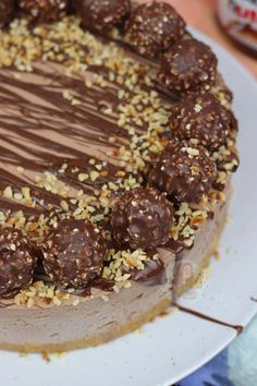 a cake with chocolate and nuts on top