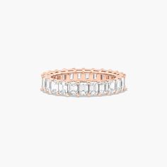 14K Rose Gold Emerald Cut Diamond Eternity Ring (3 CTW H-I / SI1-SI2). This timeless eternity ring features the boldness and elegant gleam of emerald cut diamonds. A classic, tailored shared prongs setting allows the maximum amount of the diamonds surface to show. Number of diamonds and carat total weight will vary depending on ring size. Yellow Sapphire Rings, Diamond Eternity Ring, Rings Mens Wedding Bands, Carved Ring, Classic Wedding Rings, Platinum Wedding Rings, Pink Sapphire Ring, Princess Cut Rings, Round Cut Engagement Rings