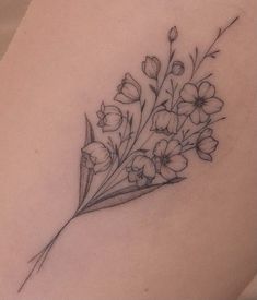 a tattoo with flowers on the back