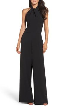 Trade in your LBD for something a bit more modern, like this halter-neck jumpsuit that can be easily dressed up or down with a change of footwear. 55" center front length; 30" inseam; 27" leg opening (size 8) Halter neck Sleeveless, with cutaway shoulders Lined 97% polyester, 3% spandex Dry clean or machine wash, tumble dry Imported Model stats: 5'10" height, 32" bust, 25" waist, 36" hip. Model is wearing size 8. Bride Jumpsuit, Bridesmaids Jumpsuits, Bride Suit, Halter Neck Jumpsuit, Coverall Jumpsuit, Bridal Jumpsuit, Wedding Jumpsuit, Fall Wedding Guest Dress, Jumpsuit Dressy