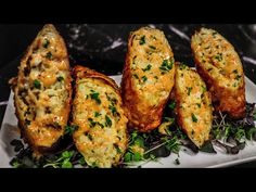 some food is on a white plate with green garnishes and parsley