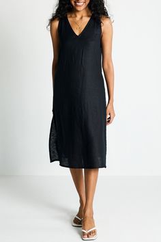 Introducing our Hemp V-Neck Straight Dress - an epitome of effortless elegance and minimalist chic. This midi-dress embodies modern sophistication with its clean lines and contemporary cut, embracing the essence of simplicity. Designed for versatility, it's a summer essential, perfect for various occasions. Its A-line fit offers comfort and style, while the V-neck and in-cut sleeves add a touch of allure. This stylish dress is complemented by functional pockets on both sides for practicality. Wa Black V-neck Midi Dress With Side Slits, Elegant Black Maxi Dress For Loungewear, Elegant Loungewear Dress With Side Slits, Sleek V-neck Maxi Dress For Summer, Chic V-neck Slip Dress With Side Slits, Chic Linen Midi-length V-neck Dress, Chic Linen Midi V-neck Dress, Elegant Unlined Midi Dress For Daywear, Elegant Unlined V-neck Midi Dress