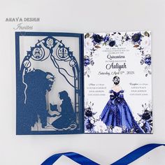 an open card with a blue ribbon on it next to a paper cut out of the silhouette of a man and woman