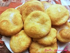 a white plate topped with sugar cookies on top of a table