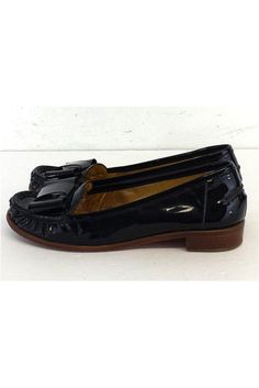 Size 6 M Black Patent Leather Loafers Made in Brazil Bow embellished toe Some outsole wear Heel height 1" Black Tassel Loafers With Round Toe, Black Patent Leather Slip-on Tassel Loafers, Black Slip-on Tassel Loafers With Closed Toe, Black Tassel Loafers Slip-on Closed Toe, Black Flat Tassel Loafers With Leather Sole, Black Slip-on Tassel Loafers With Round Toe, Black Flat Loafers Medium Width, Black Patent Leather Tassel Loafers With Round Toe, Black Flat Tassel Loafers With Brogue Detailing