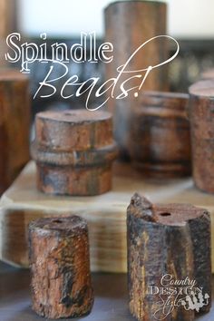 the words spindle beans are written in white ink on top of old wooden barrels