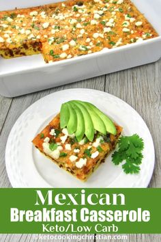 mexican breakfast casserole with avocado and sour cream in the middle on a white plate