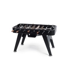 a black foosball table with wooden legs