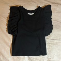 Size S, Brand New With Tags Black Stretch Blouse With Ruffles, Stretch Black Blouse With Ruffles, Black Ruffle Sleeve Tops For Fall, Black Ruffle Sleeve Top For Work, Zara Black Tops For Day Out, Casual Ruffled Tops For Night Out, Black Ruffled Tops For Night Out, Cotton Ruffle Tops For Night Out, Black Short Sleeve Top With Ruffles