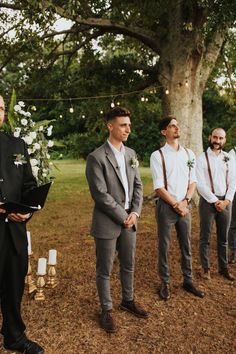 the groom is waiting for his bride to walk down the aisle at this outdoor ceremony