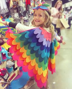 Rainbow Bird Cape Kids Owl Costume with Bird Wings and Mask Soar through the sky with these unique bird capes and matching headpeice. Each cape is uniquely designed and hand-crafted with ten feather layers of high quality fabric and matching felt headdress. You won't need binoculars--the vibrant felt colors make these bird feather capes easy to spot from a mile away. * Soft adjustable necktie * Elastic wrist loops to spread wings * High quality fabric wings * 10 colorful layers * Highly detailed How To Make Bird Wings For A Costume, Bird Wings Costume, Bird Themed Wedding, Peach Costume, Owl Costume, Diy Wings, Bird Costume, Bird Wedding, Magical Rainbow