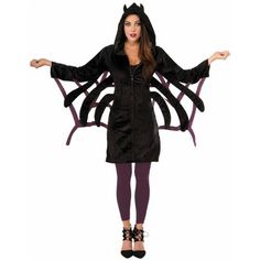 a woman in a black spider costume standing with her arms spread out and hands outstretched