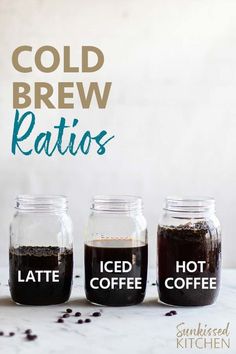 three jars filled with cold brew coffee sitting on top of a white counter next to each other