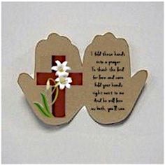 two hands holding a cross with a flower on each hand and a poem written in the middle