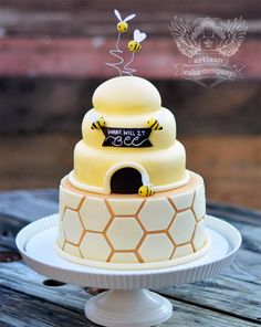 a beehive cake with honeycombs and bees on top is for sale