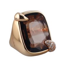 A pair of 18 karat rose gold ring set with smokey topaz and approximately 0.44ctw of G/VS diamonds. DESIGNER: Pomellato MATERIAL: 18k Rose Gold GEMSTONES: Smokey Topaz, Diamonds DIMENSIONS: Top is 30mm x 25mm. MARKED/TESTED: 750, Italian Marks, Pomellato. WEIGHT: 33.8 grams CONDITION: Previously Owned / Excellent Condition Luxury Topaz Ring With Diamond Accents, Formal Rose Gold Topaz Ring With Diamond Accents, Luxury Gold Topaz Ring, Elegant Rose Gold Topaz Ring With Diamond Accents, Elegant Polished Topaz Ring For Formal Occasions, Luxury Topaz Birthstone Ring, Luxury Topaz Rings With Rose Cut Diamonds, Luxury Topaz Ring With Rose Cut Diamonds, Elegant Topaz Rings With Polished Finish