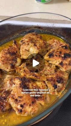 a pan filled with chicken and sauce on top of a stove