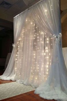 a white drape with lights on it