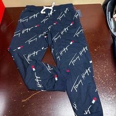 Tommy Hilfiger Mens Dark Navy All Over Print Jogger Pants Size Large Xl Brand: Tommy Hilfiger Department: Men Size: L Xl Color: Navy Type: Pants Style: Jogger Pattern: Logo Print Theme: Sports Occasion: Activewear Season: All Season Features: Comfort, Easy Care Condition: New With Tags I Offer Discounts For All Return Customers. - Jvs Casual Tommy Hilfiger Trousers, Casual Tommy Hilfiger Bottoms For Loungewear, Casual Tommy Hilfiger Loungewear Bottoms, Tommy Hilfiger Casual Loungewear Bottoms, Tommy Hilfiger Cotton Bottoms For Loungewear, Tommy Hilfiger Outfits Men, Tommy Hilfiger Outfits, Jogger Pattern, Tommy Hilfiger Sweatpants