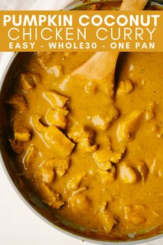 pumpkin coconut chicken curry in a white pot with a wooden spoon and text overlay that reads, pumpkin coconut chicken curry easy whole one pan