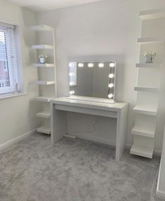 a white desk with lights on it in a room