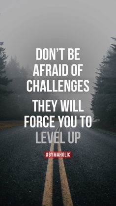 a road with the words don't be afraid of challenges they will force you to level up