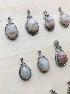 Nature-inspired Oval Agate Jewelry, Oval Cabochon Agate Jewelry For Gifts, Oval Agate Healing Jewelry, Oval Agate Gemstones For Gift, Sakura Agate, Cherry Blossom Agate, Crystal Perfume Bottles, Spiritual Crystals, Flower Agate