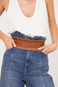 The LUSHER soft Obi wrap leather belt has a cult following. This beautiful obi belt is a comfortable simple wrap belt ideal for dresses, coats, jackets or jumpsuits. Handcrafted from our signature buttery soft Italian leather, you won't have to break this belt in, it is designed to tie very easily and sits beautifully on the body. There are so many ways to wear this belt! Obi Belts are final sale. Elegant Leather Corset Belt For Fall, Chic Leather Corset Belt For Fall, Chic Adjustable Brown Belt, Classic Corset Belt With Belt Loops, Chic Leather Corset Belt For Spring, Chic Belted Corset Belt For Spring, Spring Leather Corset Belt, Leather Corset Belt For Spring, Chic Brown Leather Corset Belt