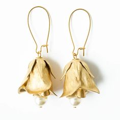 Flower Bud and Pearl Hanging Earrings - Nest Pretty Things Brass Flower Charm Earrings, Elegant Flower Shaped Brass Earrings, Elegant Flower-shaped Earrings With French Hook, Elegant Floral Earrings With French Hook, Elegant Flower Shaped Earrings With French Hook, Gold Flower Earrings For Festive Occasions, Brass Flower Earrings For Wedding, Flower-shaped Brass Wedding Earrings, Elegant Brass Flower Earrings