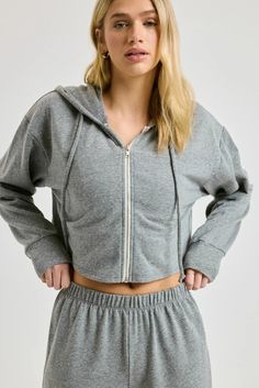 Made in an ultra-soft Tri-blend terry, the Classic Zip Up Sweatshirt has that ultimate vintage lived-in look and is the perfect cropped length. Pair with the Stadium Sweatpant for a look that’s perfect for summer beach nights. Full zip sweatshirt Slightly cropped length Long sleeve Hood with drawcords 18 1/4” length 50% POLYESTER 38% COTTON 12% RAYON Fabric: Triblend Terry Machine wash cold, lay flat dry Made in USA Beach Nights, Gym Bra, Beach Night, New Year New You, Zip Up Sweatshirt, Lounge Shorts, Rayon Fabric, Zip Sweatshirt, Biker Shorts