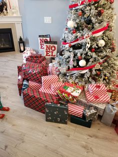 a christmas tree with presents under it