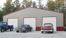 three classic trucks parked in front of a garage