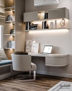 a desk with a laptop on it in a room