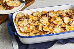 a casserole dish with bananas and other toppings in it on a table