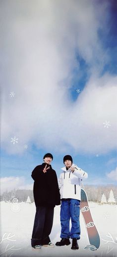 two snowboarders posing for a photo in the snow