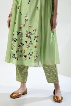 Green side tie kurta with placed dori embroidery featuring floral motifs embellished by beads. Comes with pant and dupatta. - Aza Fashions Traditional Designer Wear Bottoms For Spring, Traditional Bottoms For Spring Designer Wear, Traditional Floral Embellished Sets For Designer Wear, Traditional Floral Embellished Sets For Summer, Traditional Designer Pants For Spring, Summer Festive Pants With Floral Embroidery, Festive Designer Bottoms With Floral Embroidery, Festive Bottoms With Floral Embroidery, Summer Floral Embroidery Pista Green Sets