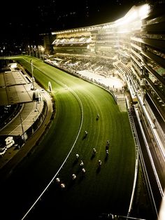 an aerial view of a race track at night