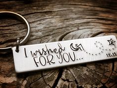 a metal keychain with the words i wished for you on it