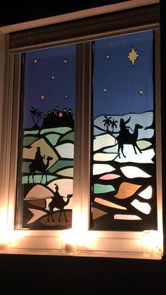 two stained glass windows with nativity scene on them