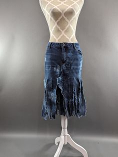 "Upcycled bleached fringe hem denim skirt. Waist measures 38\", hips 42\" and length is approximately 23\"." Fitted Medium Wash Skirt With Frayed Hem, Dark Wash Distressed Cutoff Denim Skirt, Distressed Dark Wash Cutoff Denim Skirt, Fitted Washed Blue Bottoms With Frayed Hem, Fitted Cotton Denim Skirt With Frayed Hem, Fitted Cutoff Skirt With Frayed Hem, Fitted Denim Blue Skirt With Frayed Hem, Washed Blue Denim Skirt With Frayed Hem, Medium Wash Cotton Denim Skirt With Frayed Hem