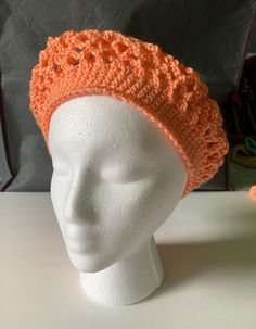 I hand crochet this lacey beret to be lightweight. Not just for winter, an open weave transitions the seasons. Wear as a fashion statement with a boho vibe. The Apricot orange color acrylic yarn is machine washable. 20" band fits most adults. Fitted Crochet Hat For Spring, Spring Crochet Lace Hat, Fitted Crochet Yarn Hat, Spring Crochet Slouchy Hat, Fitted Crochet Cap For Spring, Fitted Crochet Spring Cap, Fitted Crochet Beanie For Spring, Orange Crochet Hat For Spring, Fitted Beanie Crochet Hat For Spring