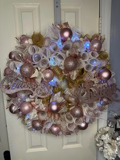 a wreath made out of paper and christmas ornaments