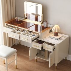 a dressing table with drawers and a mirror