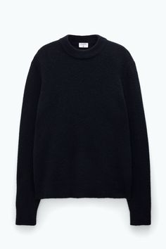 Classic Black Merino Wool Sweater, Classic Black Sweater With Ribbed Collar, Classic Black Sweater With Ribbed Cuffs, Black Merino Wool Sweater With Ribbed Collar, Classic Black Turtleneck Outerwear, Black Cashmere Outerwear With Ribbed Cuffs, Black Fine Knit Wool Sweater, Black Wool Fine Knit Sweater, Classic Black Turtleneck Sweater