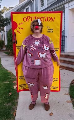 a woman dressed as a clown standing in front of a sign that says operation on it